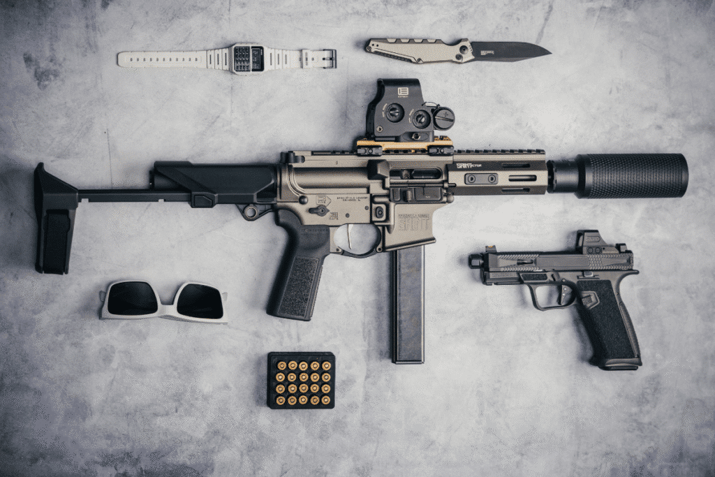 A firearm fitted with an SB Tactical brace alongside shooting accessories
